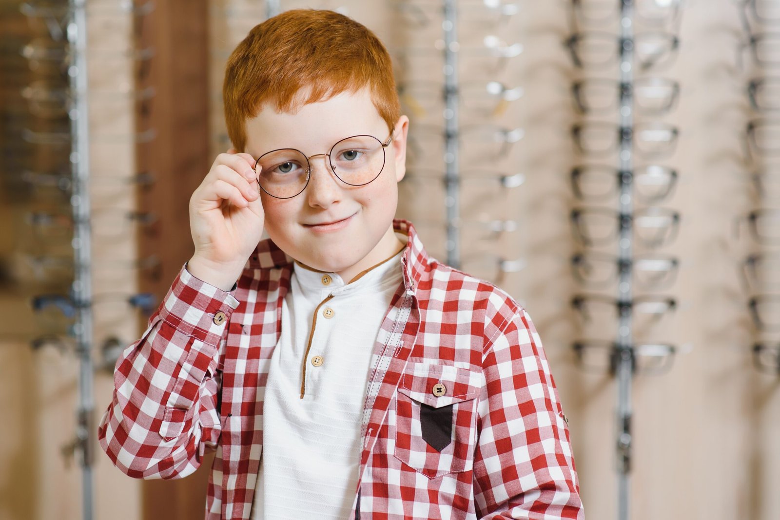 boy in glasses at optics store